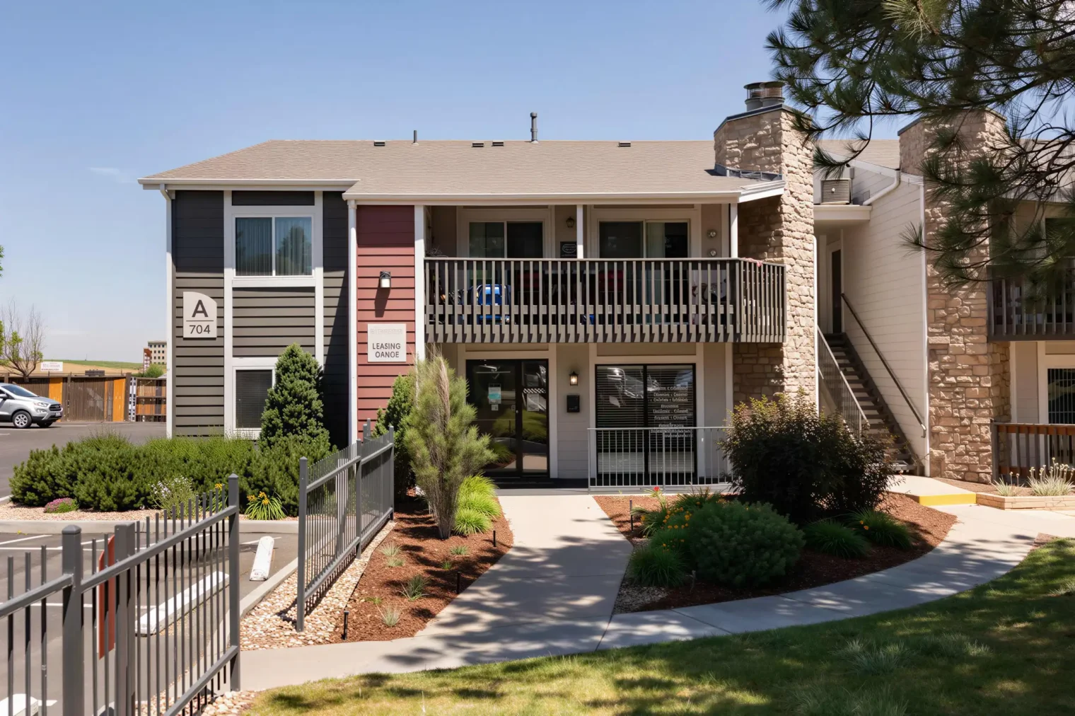 Leasing office and landscaped entrance at Oak Ridge Apartments in Aurora, Colorado