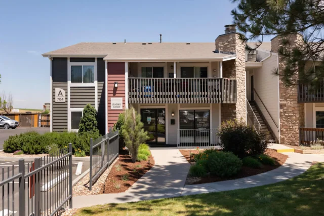 Leasing office and landscaped entrance at Oak Ridge Apartments in Aurora, Colorado
